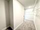 Spacious walk-in closet with multiple levels of shelving for maximum storage and organizational potential at 320 Bishop Ln, Sanford, NC 27330
