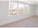Bright bedroom featuring treetop views from large windows at 3939 Willow Gate Way, Knightdale, NC 27604