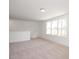 Upstairs bedroom with neutral carpet and natural light at 3939 Willow Gate Way, Knightdale, NC 27604