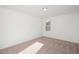 Simple bedroom with neutral carpeting and a window at 3939 Willow Gate Way, Knightdale, NC 27604