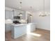 Modern kitchen with white cabinets, quartz countertops, and gold lighting at 3939 Willow Gate Way, Knightdale, NC 27604