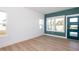 Bright office with hardwood floors, large windows and teal accent wall at 3939 Willow Gate Way, Knightdale, NC 27604