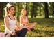 Two women relaxing and meditating in a tranquil park setting at 3939 Willow Gate Way, Knightdale, NC 27604