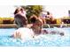 Gathering enjoying a refreshing swim in the community pool at 3939 Willow Gate Way, Knightdale, NC 27604