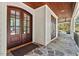 Exterior view of the front entryway with a covered porch, double doors, and stone flooring at 488 Colvard Farms Rd, Durham, NC 27713