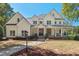 An inviting front exterior view showcasing the home's beautiful architecture and manicured front yard at 488 Colvard Farms Rd, Durham, NC 27713