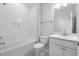 Bright bathroom with modern fixtures, including a tiled shower and a sleek vanity at 1829 Hydrangea Way, Fuquay Varina, NC 27526