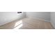 Sunlit bedroom with plush carpeting and a large window providing ample natural light at 1829 Hydrangea Way, Fuquay Varina, NC 27526