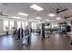 Well-equipped gym with modern exercise machines and ample natural light at 1829 Hydrangea Way, Fuquay Varina, NC 27526