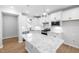 Bright kitchen with white cabinetry, granite countertops, stainless steel appliances, and pendant lighting at 1829 Hydrangea Way, Fuquay Varina, NC 27526