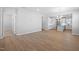 Spacious open-concept living area featuring laminate flooring and a view of the kitchen, offering a bright space at 1829 Hydrangea Way, Fuquay Varina, NC 27526