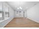Bright living room with recessed lighting, large windows with blinds, and laminate flooring at 1829 Hydrangea Way, Fuquay Varina, NC 27526