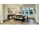Bright dining area with large windows and a dark wood table with bench seating at 2007 Opulent Oaks Ln # 24, Durham, NC 27713