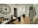 Bright entry hall with modern light fixture and staircase at 2007 Opulent Oaks Ln # 24, Durham, NC 27713