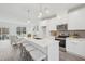 Modern kitchen features white cabinets, stainless steel appliances, and a large island at 2007 Opulent Oaks Ln # 24, Durham, NC 27713