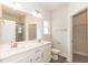 Bathroom boasts double vanity, large mirror, and walk-in shower at 214 Drayton Hall Ln, Sanford, NC 27330