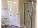 Main bathroom with shower, toilet and linen closet at 214 Drayton Hall Ln, Sanford, NC 27330