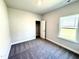 Charming bedroom features closet, window and neutral walls at 214 Drayton Hall Ln, Sanford, NC 27330