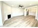 Bright living room features a fireplace, neutral walls, and elegant hardwood flooring for a cozy feel at 214 Drayton Hall Ln, Sanford, NC 27330