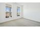 Bright bedroom with plush carpeting and large windows offering natural light at 2209 Abbeyhill Dr # 118, Raleigh, NC 27610