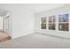 Inviting bedroom with plush carpets, neutral walls, and bright sunny windows at 2209 Abbeyhill Dr # 118, Raleigh, NC 27610