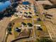 Aerial view of a new construction community with homes and a tranquil pond at 224 Bering Cir, Angier, NC 27501