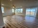 Bright living room with hardwood floors, many windows and sliding glass door access at 224 Bering Cir, Angier, NC 27501