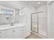 A bright bathroom features a granite vanity and glass shower with a bench at 32 Boyce Ct, Sanford, NC 27332