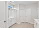 A well-lit bathroom has a single-sink vanity and tile flooring at 32 Boyce Ct, Sanford, NC 27332