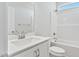 Bright bathroom featuring a shower/tub, toilet, and single-sink vanity with storage at 32 Boyce Ct, Sanford, NC 27332