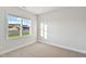 Bedroom with a large window that overlooks a lush yard at 32 Boyce Ct, Sanford, NC 27332