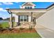 Inviting home featuring stone pillar accents and a charming front porch at 32 Boyce Ct, Sanford, NC 27332