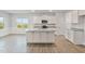 Spacious, open concept kitchen featuring a large kitchen island and modern appliances at 32 Boyce Ct, Sanford, NC 27332