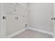 Laundry room with wire shelving and gray tile flooring at 32 Boyce Ct, Sanford, NC 27332