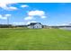 Rear view of white home situated on a large lot with blue sky at 32 Boyce Ct, Sanford, NC 27332