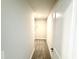 A long, narrow walk-in closet with shelving and carpeted floors at 335 Bishop Ln, Sanford, NC 27330