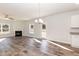 Spacious living room with hardwood floors, corner fireplace and lots of natural light at 335 Bishop Ln, Sanford, NC 27330