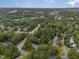 Expansive aerial view of a peaceful neighborhood, featuring tree-lined streets and scenic surroundings at 416 Englewood Dr, Chapel Hill, NC 27514