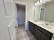 Bathroom featuring double sinks, modern countertops, and vanity at 225 Bering Cir, Angier, NC 27501