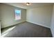 Bedroom featuring a large window and neutral walls at 225 Bering Cir, Angier, NC 27501