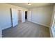Bedroom featuring a closet, neutral walls, and carpeted flooring at 225 Bering Cir, Angier, NC 27501