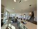 Open kitchen with white countertops, stainless steel appliances and a view of the dining and living spaces at 225 Bering Cir, Angier, NC 27501