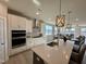 Modern kitchen with an island and stylish pendant lighting at 225 Bering Cir, Angier, NC 27501