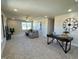 Upstairs living space including a ceiling fan, modern furniture, and a study desk at 225 Bering Cir, Angier, NC 27501