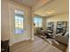 Inviting living room featuring natural light, neutral decor, and hardwood floors at 225 Bering Cir, Angier, NC 27501