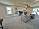 Neutral living room featuring a TV, modern sofas, and large windows at 225 Bering Cir, Angier, NC 27501