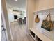 Inviting mud room with bench seating, storage baskets, and convenient access to the kitchen at 225 Bering Cir, Angier, NC 27501