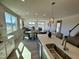 Bright open floorplan featuring water views, a kitchen island and a seamless connection to dining and living areas at 225 Bering Cir, Angier, NC 27501