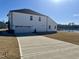 Spacious two-car garage and backyard pond at 225 Bering Cir, Angier, NC 27501