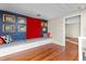 Bonus room with built-in seating and lots of framed art on a blue accent wall at 2416 Glencoe St, Burlington, NC 27217